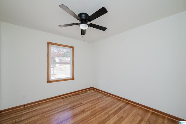 spare room with ceiling fan and hardwood / wood-style flooring