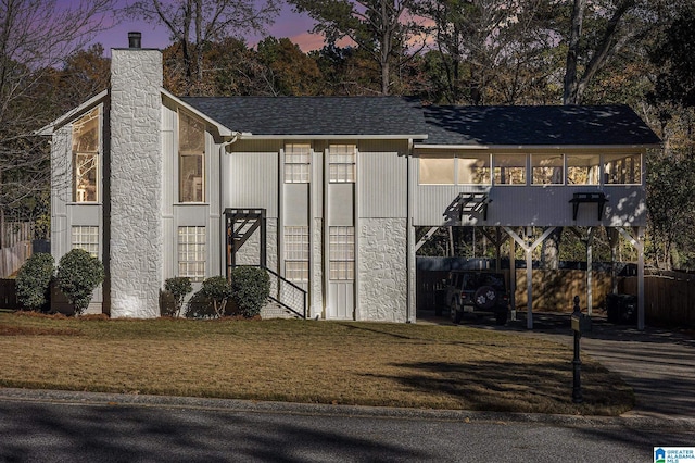 outdoor structure at dusk with a carport