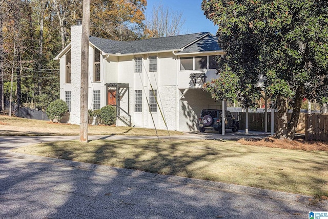 rear view of property with a carport