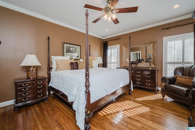 bedroom with wood-type flooring, multiple windows, and ceiling fan