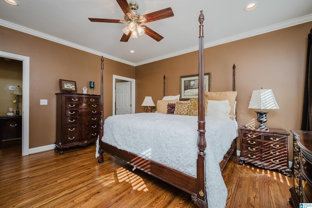 bedroom featuring hardwood / wood-style floors, ceiling fan, and crown molding