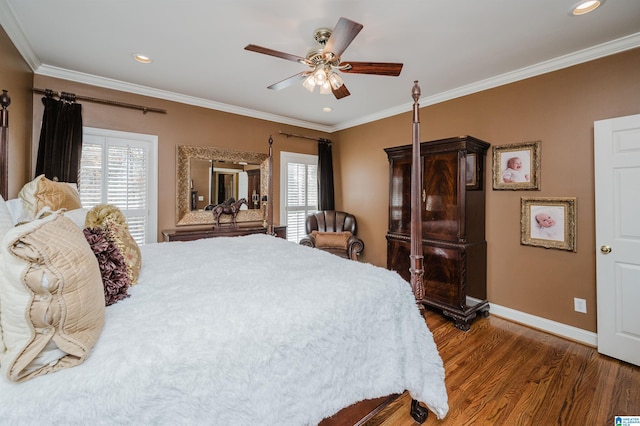 bedroom featuring dark hardwood / wood-style flooring, multiple windows, crown molding, and ceiling fan