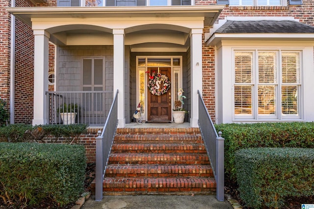 entrance to property featuring a porch