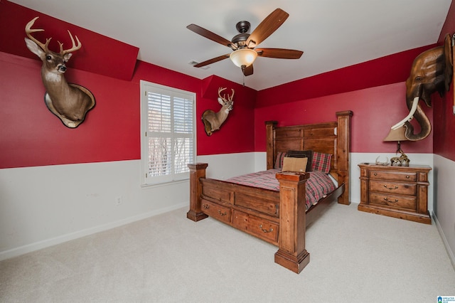 bedroom with ceiling fan and light carpet