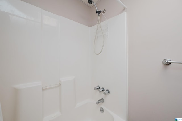 bathroom with shower / washtub combination