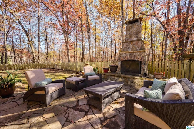 view of patio / terrace with an outdoor stone fireplace