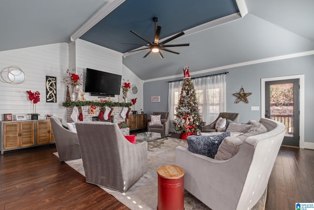 living room featuring dark hardwood / wood-style flooring, ceiling fan, plenty of natural light, and lofted ceiling