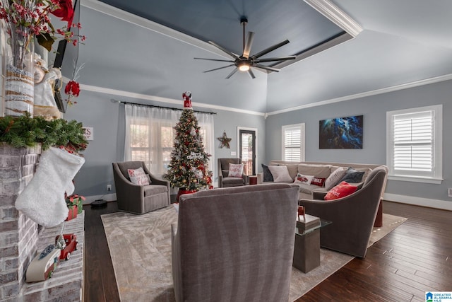 living room with lofted ceiling, crown molding, ceiling fan, and dark wood-type flooring