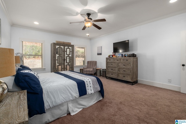 carpeted bedroom featuring ceiling fan and crown molding