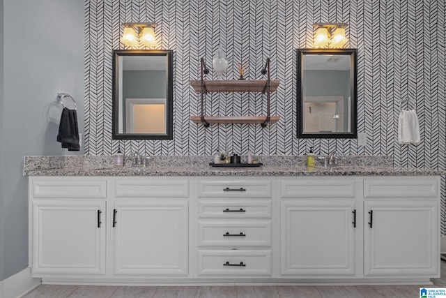 bathroom with vanity and tasteful backsplash