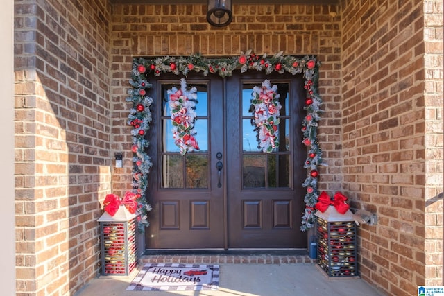 view of exterior entry featuring french doors