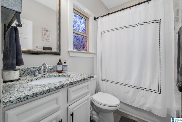 full bathroom featuring vanity, toilet, and shower / bath combo with shower curtain