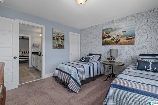 carpeted bedroom featuring ensuite bathroom