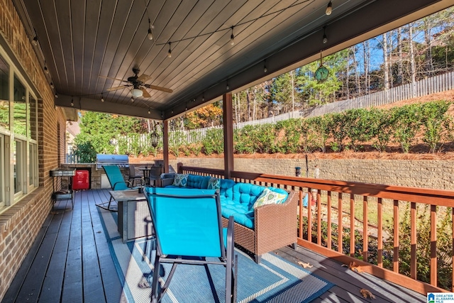 wooden deck with a grill, ceiling fan, and an outdoor hangout area