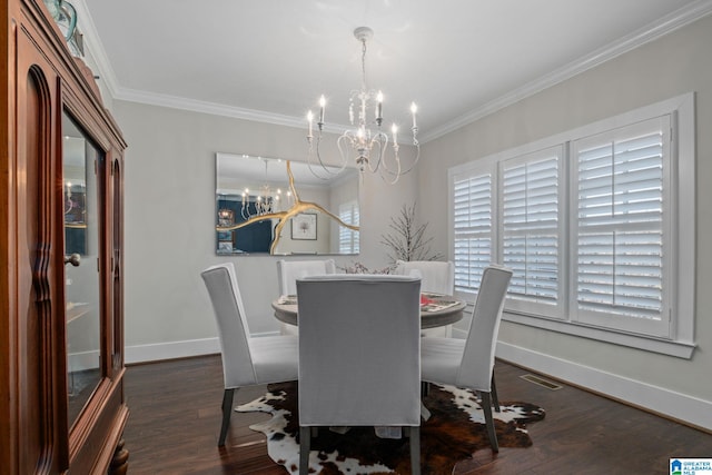 dining area featuring crown molding, dark hardwood / wood-style floors, and a notable chandelier