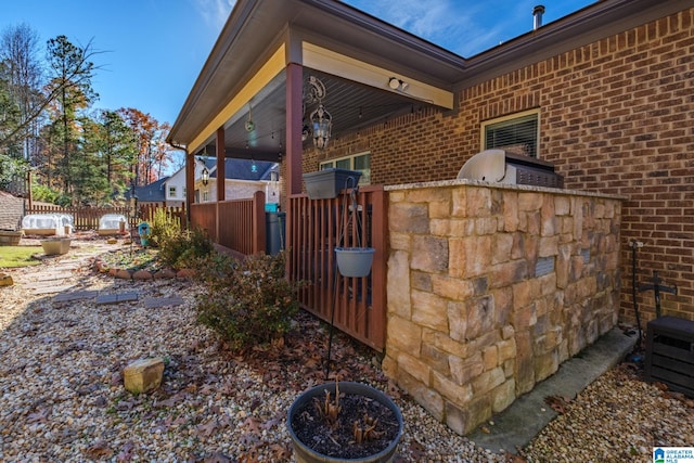 view of home's exterior featuring an outdoor kitchen