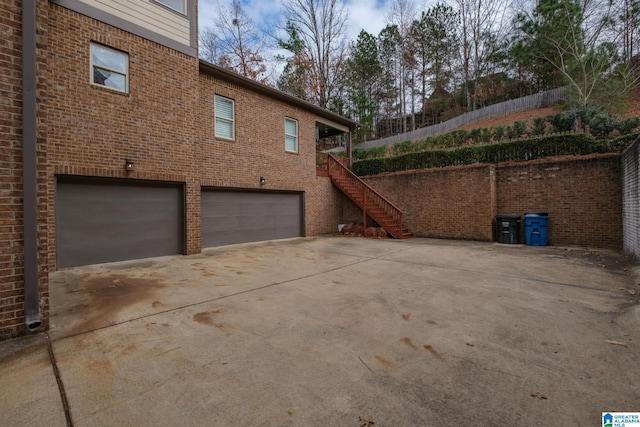 view of property exterior with a garage