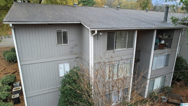 back of house featuring central air condition unit