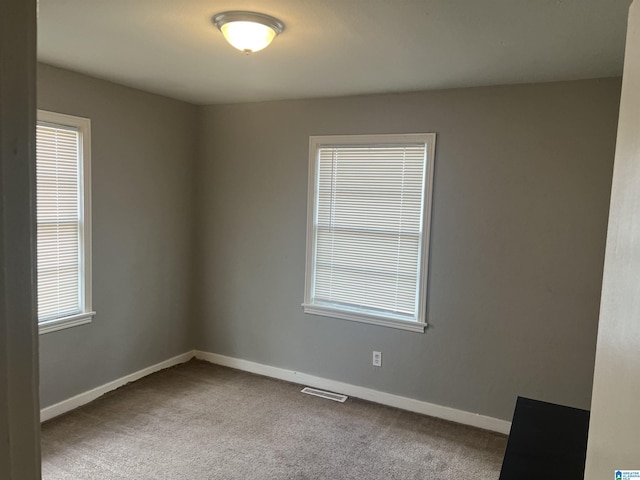 unfurnished room with carpet