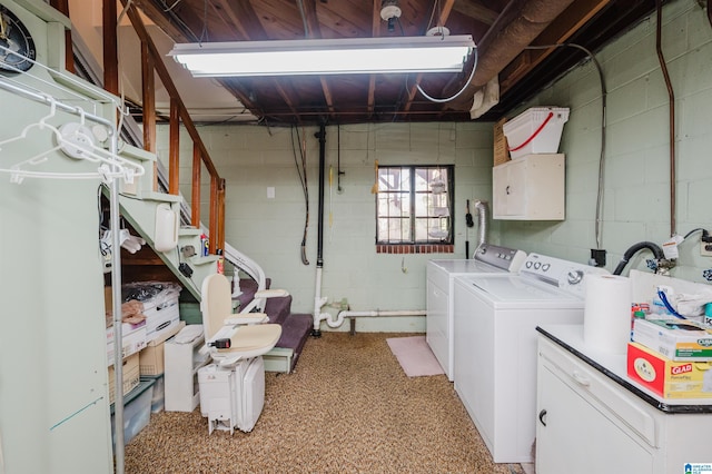 washroom featuring cabinets and separate washer and dryer