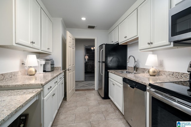 kitchen with crown molding, sink, white cabinets, and appliances with stainless steel finishes