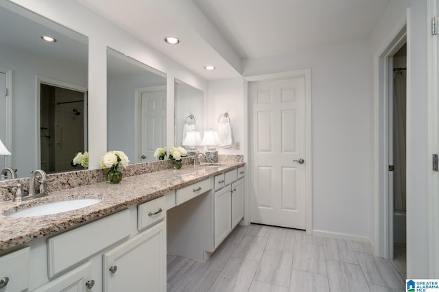 bathroom with a shower and vanity