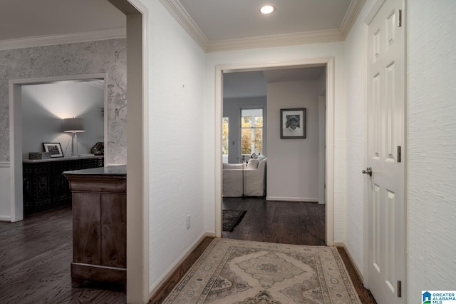 hallway with dark hardwood / wood-style floors and ornamental molding