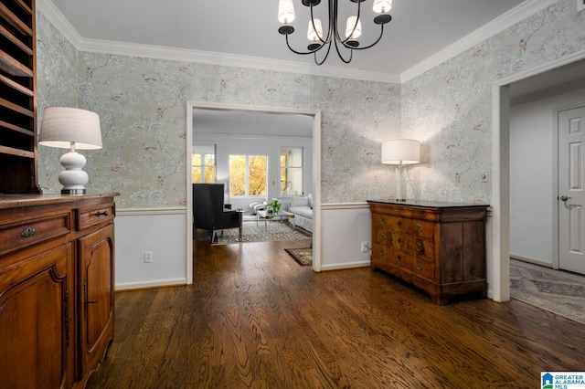 corridor with a notable chandelier, ornamental molding, and dark wood-type flooring