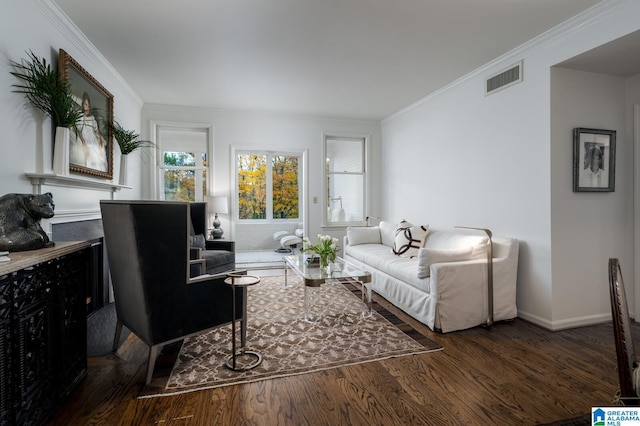 living room with dark hardwood / wood-style flooring and crown molding