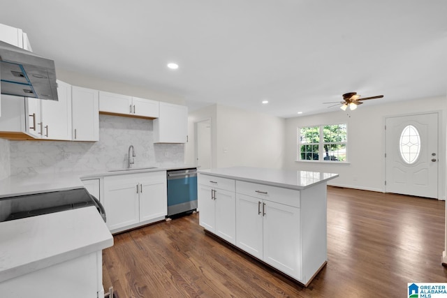 kitchen featuring dark hardwood / wood-style flooring, white cabinets, ceiling fan, sink, and dishwasher