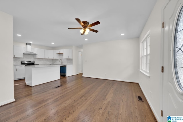 interior space featuring ceiling fan, dark hardwood / wood-style flooring, and sink