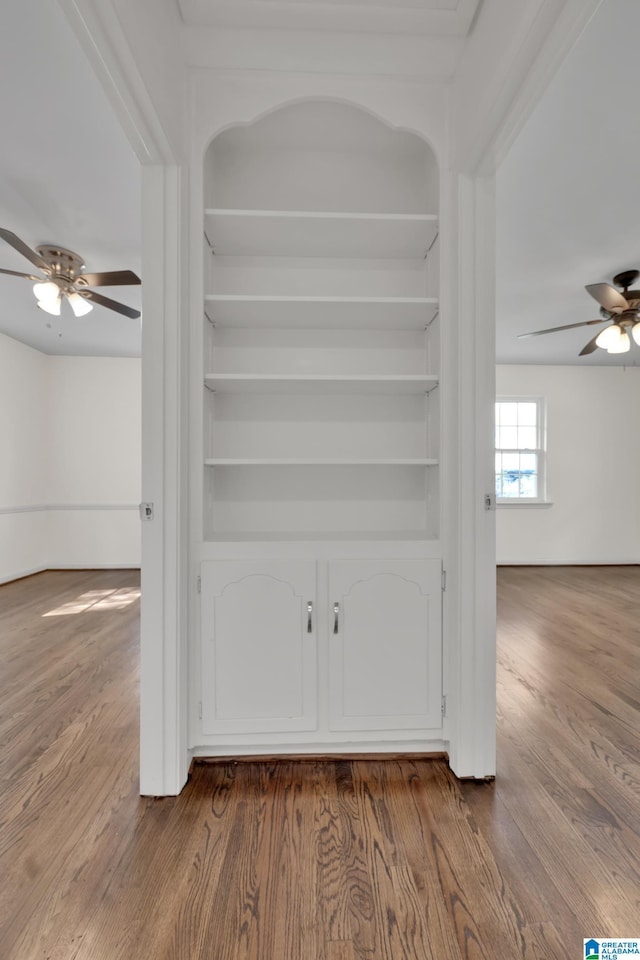 interior details with ceiling fan and hardwood / wood-style flooring