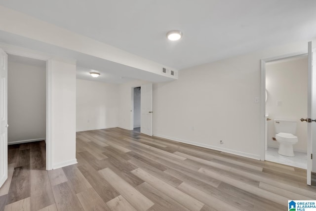 basement featuring light hardwood / wood-style floors