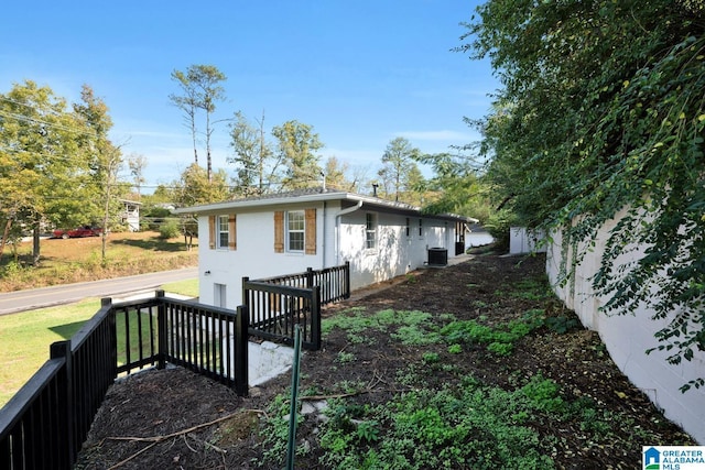 view of home's exterior with cooling unit