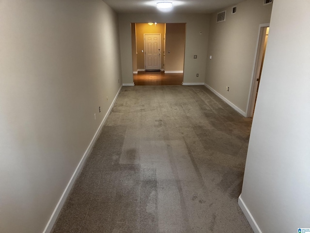 hallway with carpet floors