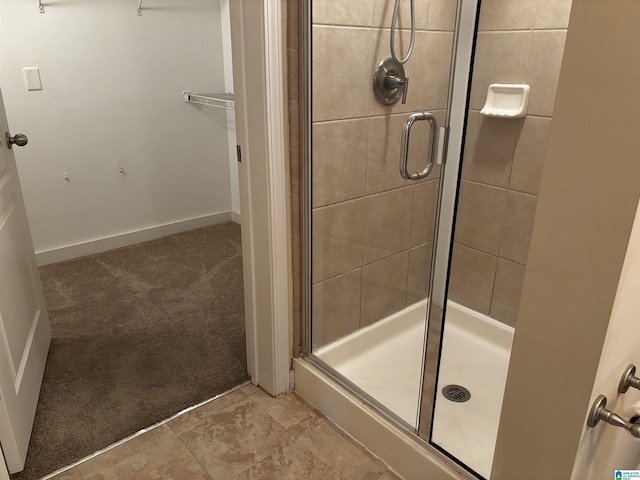 bathroom featuring tile patterned floors and walk in shower