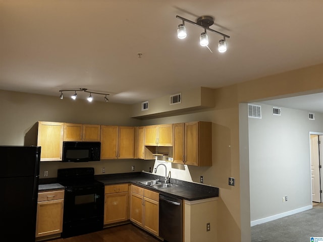 kitchen featuring black appliances, sink, and dark colored carpet