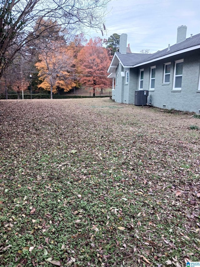 view of yard featuring central AC