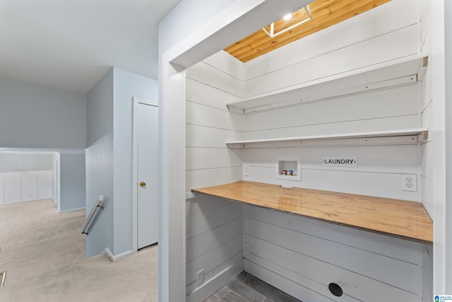 interior space with light carpet and wood counters