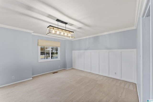 unfurnished room featuring light carpet and ornamental molding