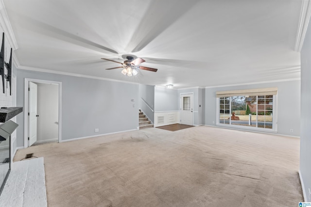 unfurnished living room with ceiling fan, light colored carpet, and ornamental molding