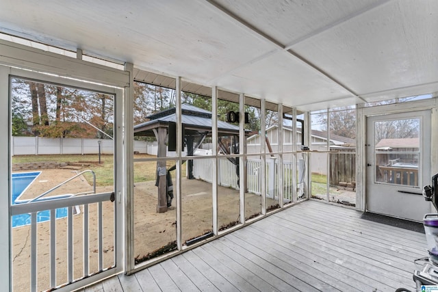 unfurnished sunroom with plenty of natural light