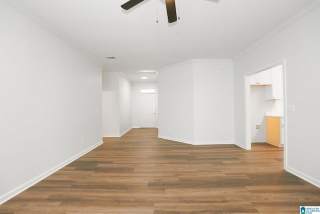 unfurnished room featuring hardwood / wood-style floors, ceiling fan, and ornamental molding