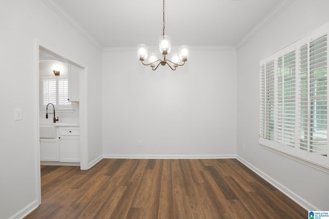 unfurnished dining area featuring a healthy amount of sunlight, dark hardwood / wood-style flooring, crown molding, and a chandelier