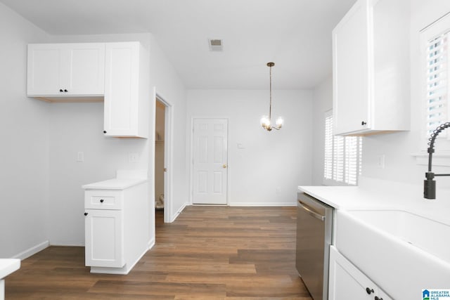 kitchen featuring pendant lighting, dishwasher, dark hardwood / wood-style flooring, and white cabinets