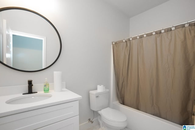 full bathroom with shower / bath combination with curtain, toilet, and vanity