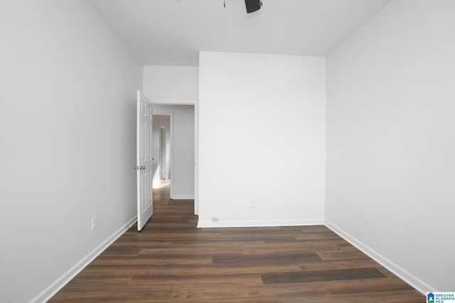 unfurnished room featuring dark hardwood / wood-style flooring