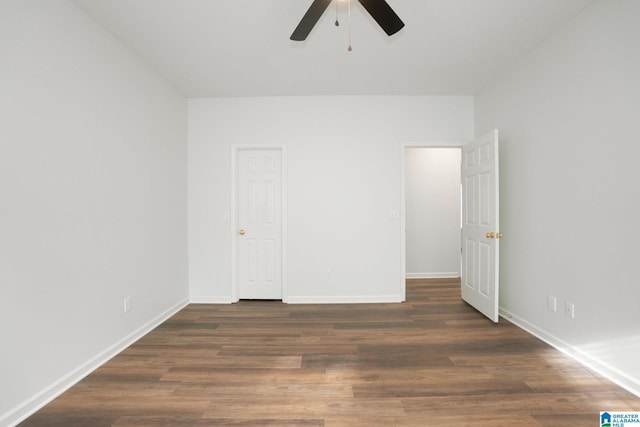 unfurnished bedroom featuring dark hardwood / wood-style flooring and ceiling fan