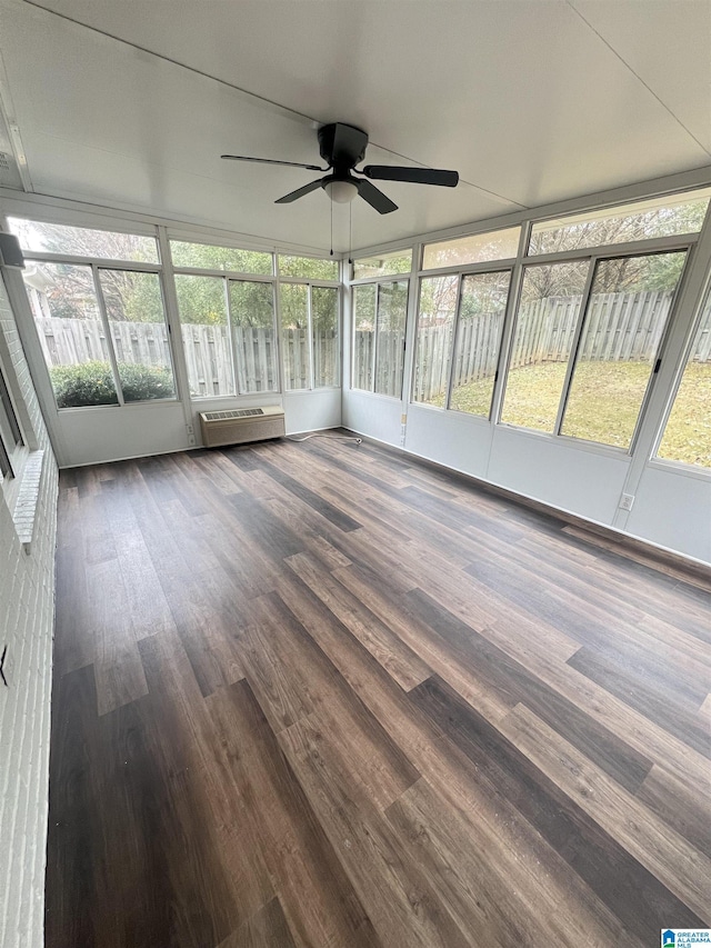 unfurnished sunroom with a wealth of natural light and ceiling fan