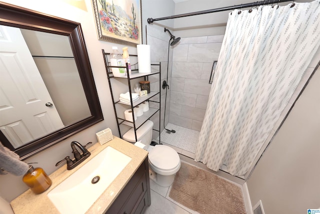 bathroom featuring tile patterned floors, a shower with curtain, vanity, and toilet